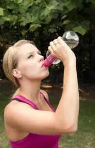 16319-a-young-woman-drinking-water-during-exercise-pv