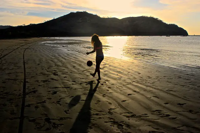 soccer juggling beach